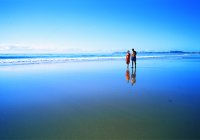 couple walking along beach